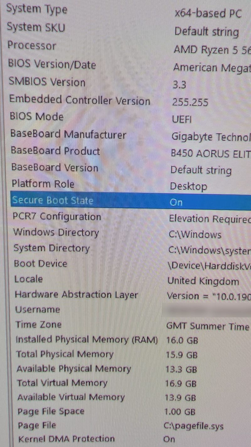 Phone photo of System Information on the repaired PC showing B450 AORUS ELITE, BIOS Mode UEFI and Secure Boot State On