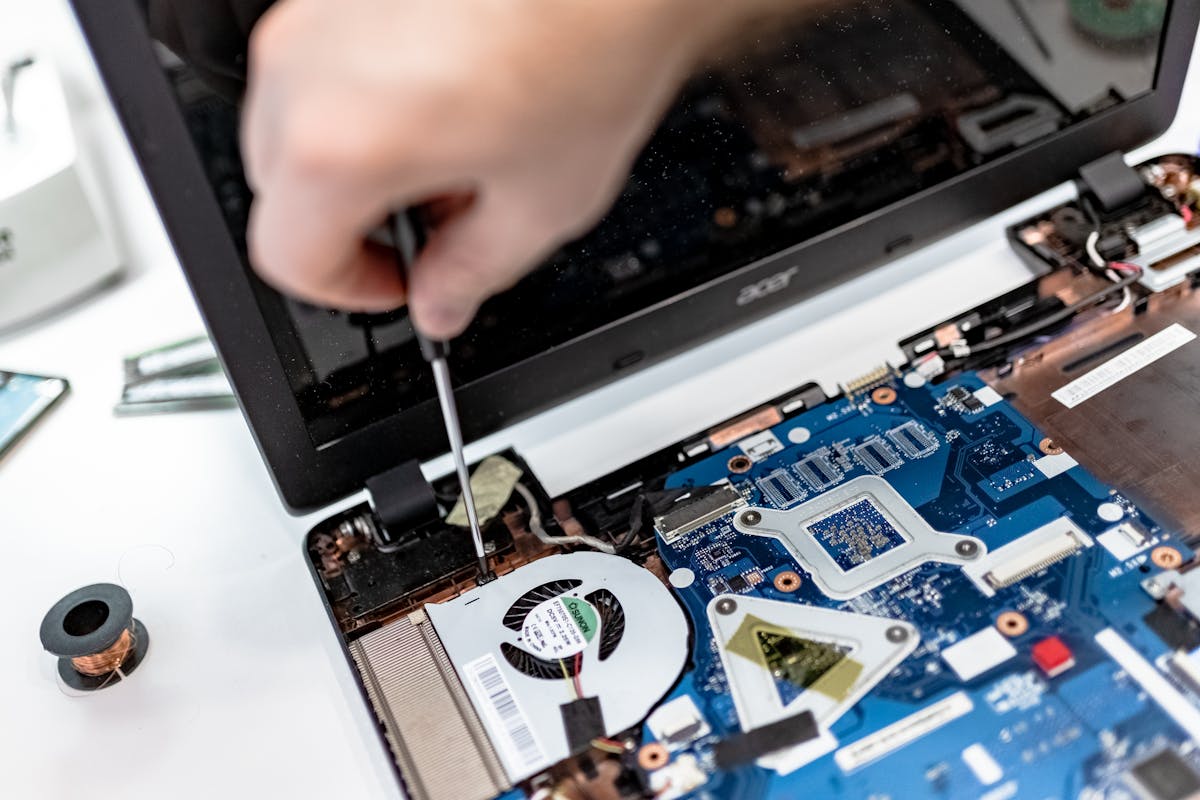 Close-up of computer motherboard being repaired